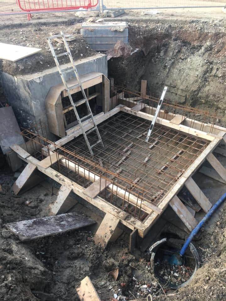 Fenced and signed excavation with formwork below ground