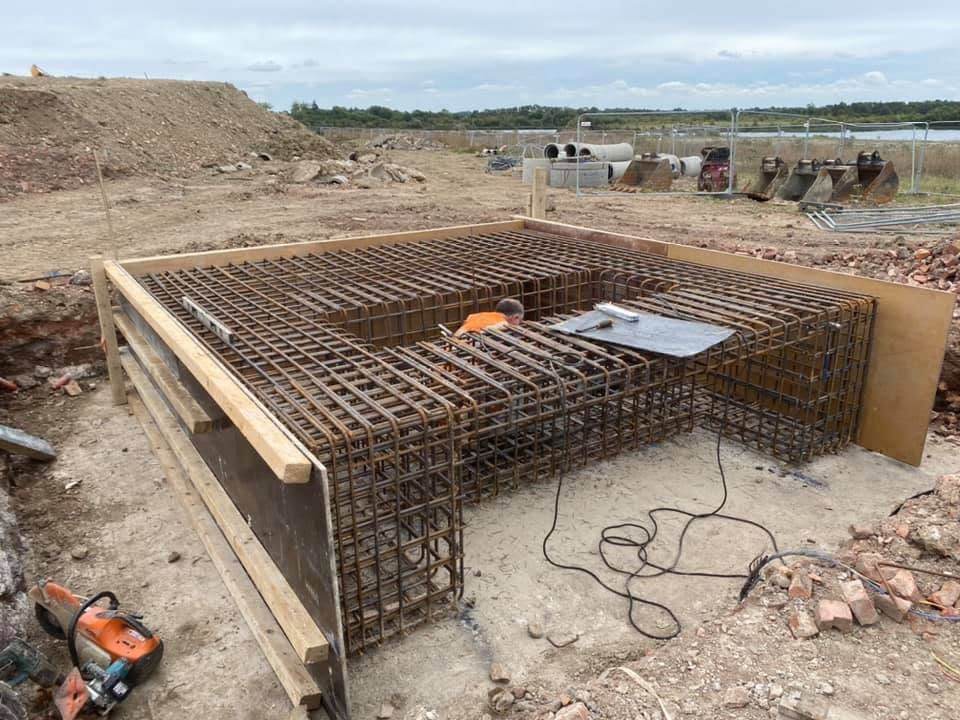 Reinforcement mat laid in a footing trench