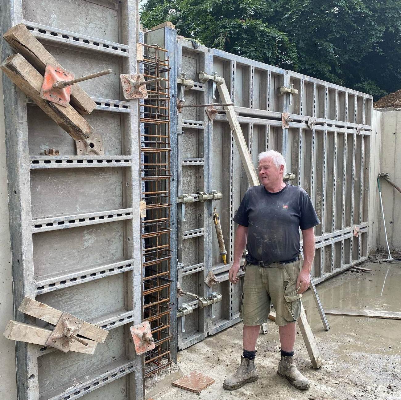 Reilly Contractors team member beside completed formwork