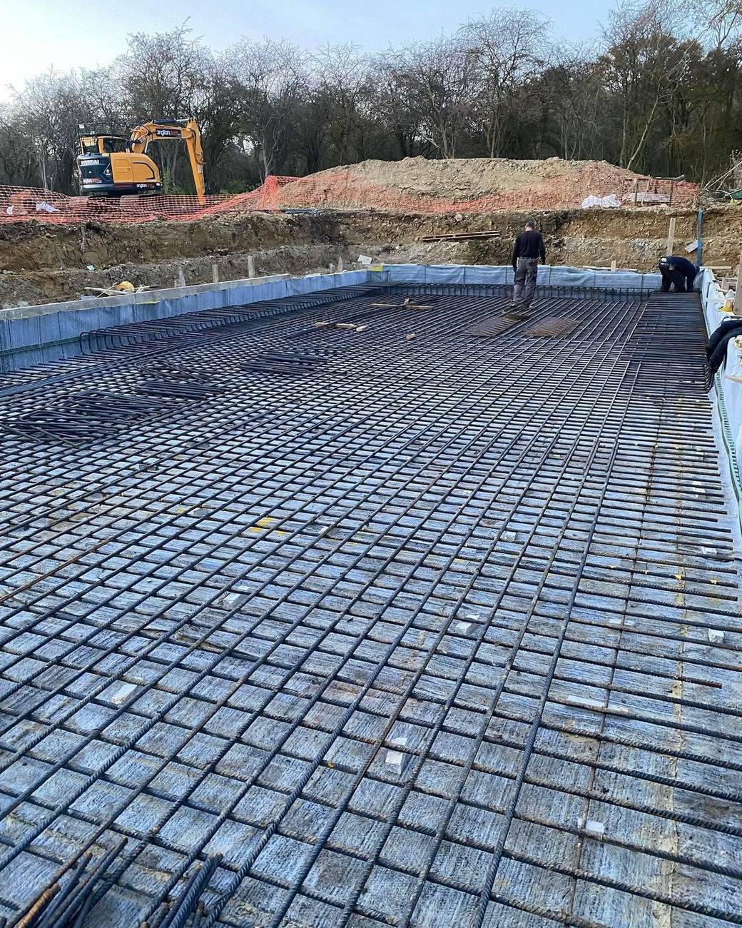 Swimming pool base fully meshed and membraned, ready to pour
