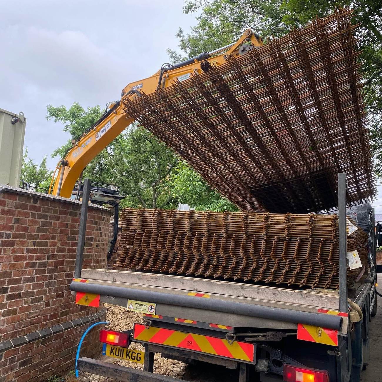Lorry delivering reinforcement cages to site